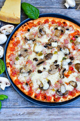  Home made  italian pizza with salami and mushrooms