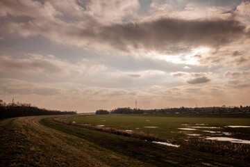 Wet landscape with cloudy sky