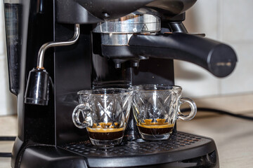 Process of making two espresso shots using espresso machine. Italian coffee.