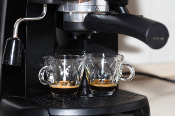Process of making two espresso shots using espresso machine. Italian coffee.