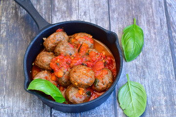 Tasty home made    italian  dish mini  meatballs baked in marinara tomato  sauce