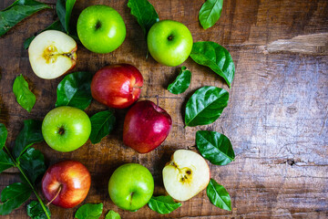.Fresh fruit, green apple and red apple on a wooden background