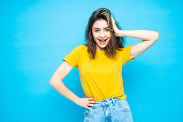 Fototapeta na wymiar Young pretty woman with hands on head isolated on blue background