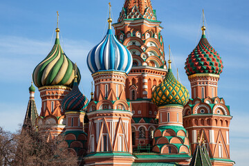 Fototapeta na wymiar Colorful domes of St. Basil's Cathedral on a background of blue sky. Moscow, Russia