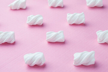 Marshmallows on a pink background
Soft pink color mini marshmallows dessert top view, flat lay style.