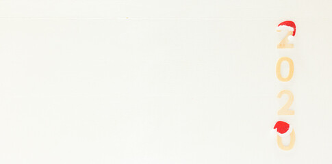 Fototapeta premium White Decorative 2020 Wooden Horizontal Background with Copy Space for Message, Banner. Top View, Flat Lay Composition. Concept: Marry Christmas and Happy New Year. 