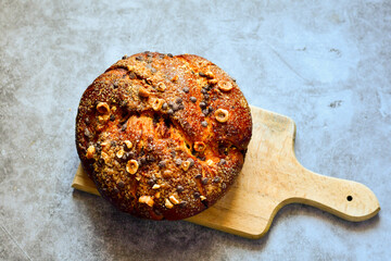 Traditional  italian easter  bread cake with  sugar,chocolate and nuts and  spring bloom 