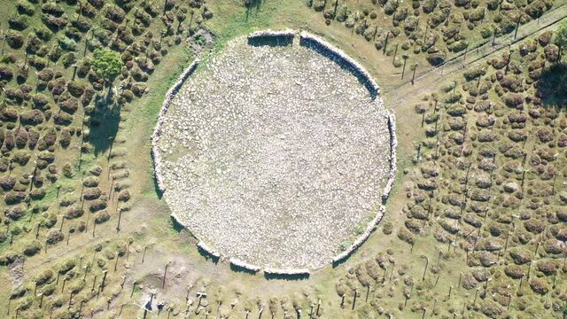 zoom-out birds eye view over the central stone circle at Sad Hill Cemetery in Contreras (Santo Domingo de Silos), province of Burgos, Castile and Leon, Spain