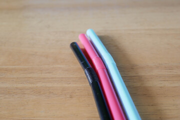 Fototapeta premium used drinking straws on blue background