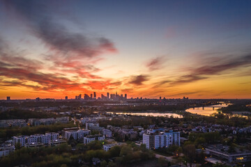 Fototapeta premium Drone view of Siekierki estate, part of Mokotow district in Warsaw, capital city of Poland, Warsaw downtown on background