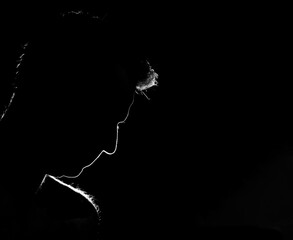 backlight and profile man thinking