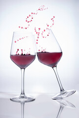 red wine glasses simulating love couple