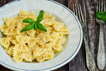 Farfalle pasta  cacio e pepe , olive oil,parmesan cheese, black pepper  and fresh onion. Vegetarian home made italian pasta