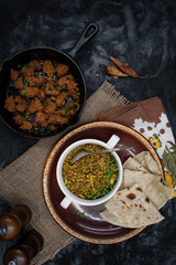 vegan lentil and celery stew served with flat breads and roasted seitan