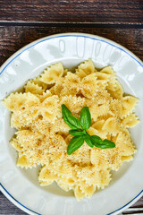 Farfalle pasta  cacio e pepe , olive oil,parmesan cheese, black pepper  and fresh onion. Vegetarian home made italian pasta