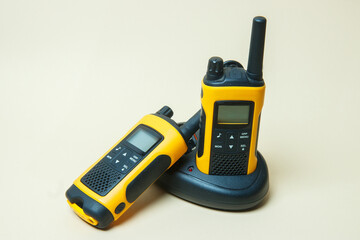 yellow walkie-talkies on a light background