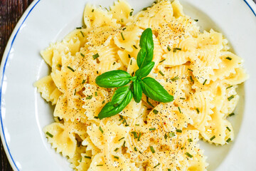 Farfalle pasta  cacio e pepe , olive oil,parmesan cheese, black pepper  and fresh onion. Vegetarian home made italian pasta