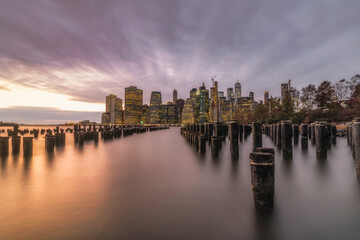 Sunset over the New York City skyline from  the Brooklyn Bridge Park. 