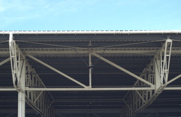 Naklejka premium steel roof over blue sky
