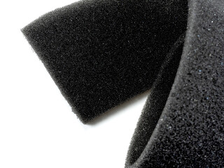 Roll of black sponge foam insulated on a white background