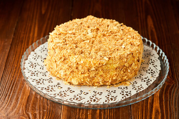 Traditional fresh dessert Napoleon cake on wooden background