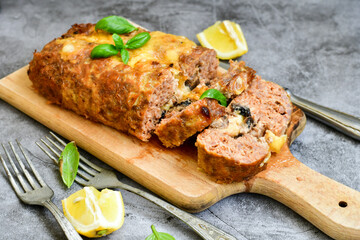 Home made baked  delicious  italian  traditional meatloaf filled  with cheese and mushrooms 