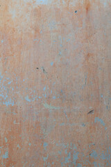 Old grungy concrete wall with peeling paint