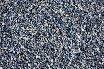 Top view of blue construction gravel texture background. Small granite stone full frame background.