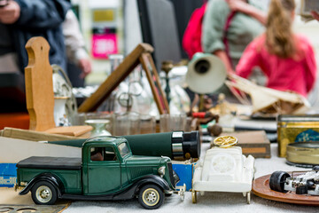 Many various items being sold on outdoor flee market.