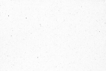 White paper or cardboard texture with black spot background.