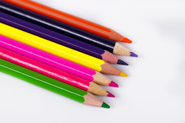 colored pencils on white background