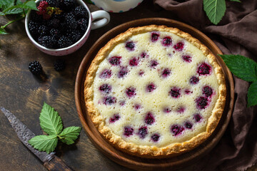 Homemade blackberry pie. Sweet pie with blackberry on rustic wooden table.