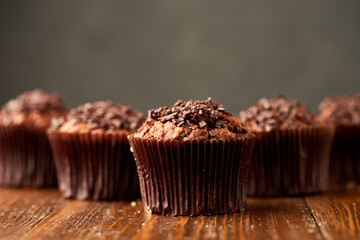 Traditional fresh dessert chocolate muffin on wooden background