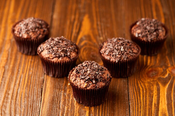 Traditional fresh dessert chocolate muffin on wooden background