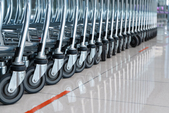 A row of carts in a supermarket. Carts for luggage.