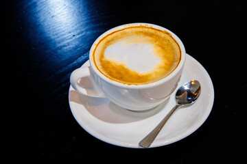 cup of coffee on a black table