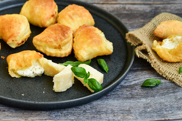 Fresh baked home made  Mini cheese puff pastries.Cheese pie with phyllo pastry and herbs