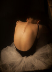 Asian dancers huddled in the dark