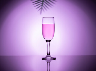 a glass of rose wine on the glass, taken to the light