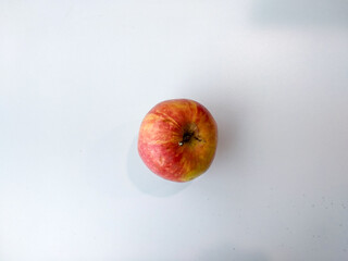 Apple on a white background from above with space for text