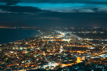 Terracina, Italy. Top View Skyline Cityscape City In Night Illuminations