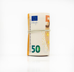 Banknotes fifty 50 euros in a roll with an elastic band. European currency to save. Close-up, white background. The concept of the safety of deposits and money.