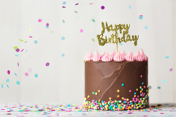 Chocolate birthday cake with happy birthday banner