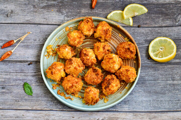  Home made Crispy Chicken   Popcorn with honey mustard sauce on wooden background