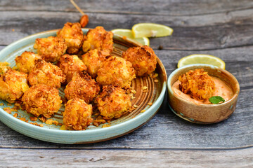  Home made Crispy Chicken   Popcorn with honey mustard sauce on wooden background