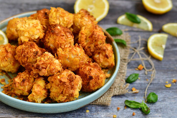  Home made Crispy Chicken   Popcorn with honey mustard sauce on wooden background