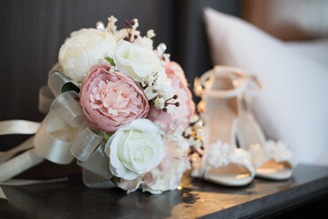 
Bridal shoes with bouquet