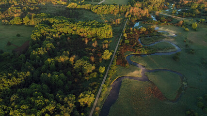 Aerial view of american countryside in the summertime. Sunrise, dawn, misty early morning. North american rural landscape,  Beautiful nature of Midwest