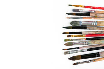 art background with paint brushes top view with copy space.