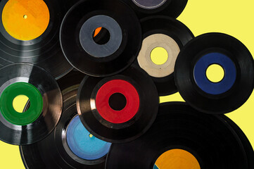 Vynil records over a yellow vintage background 